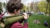 Ukraine -- Boy aims from model of RPG (Rocket-propelled grenade) at the cars during knives exhibition "Steel line" in Kyiv, 23Apr2017